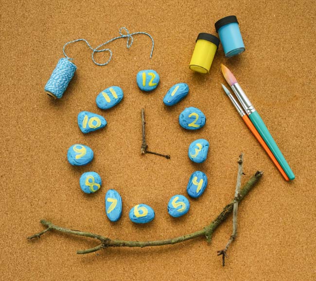 Make a nature-inspired rock clock to teach children math skills and introduce children to telling time
