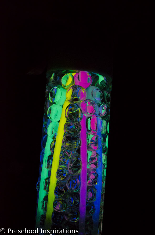 Make a super simple glow in the dark sensory bottle with glow sticks and water beads