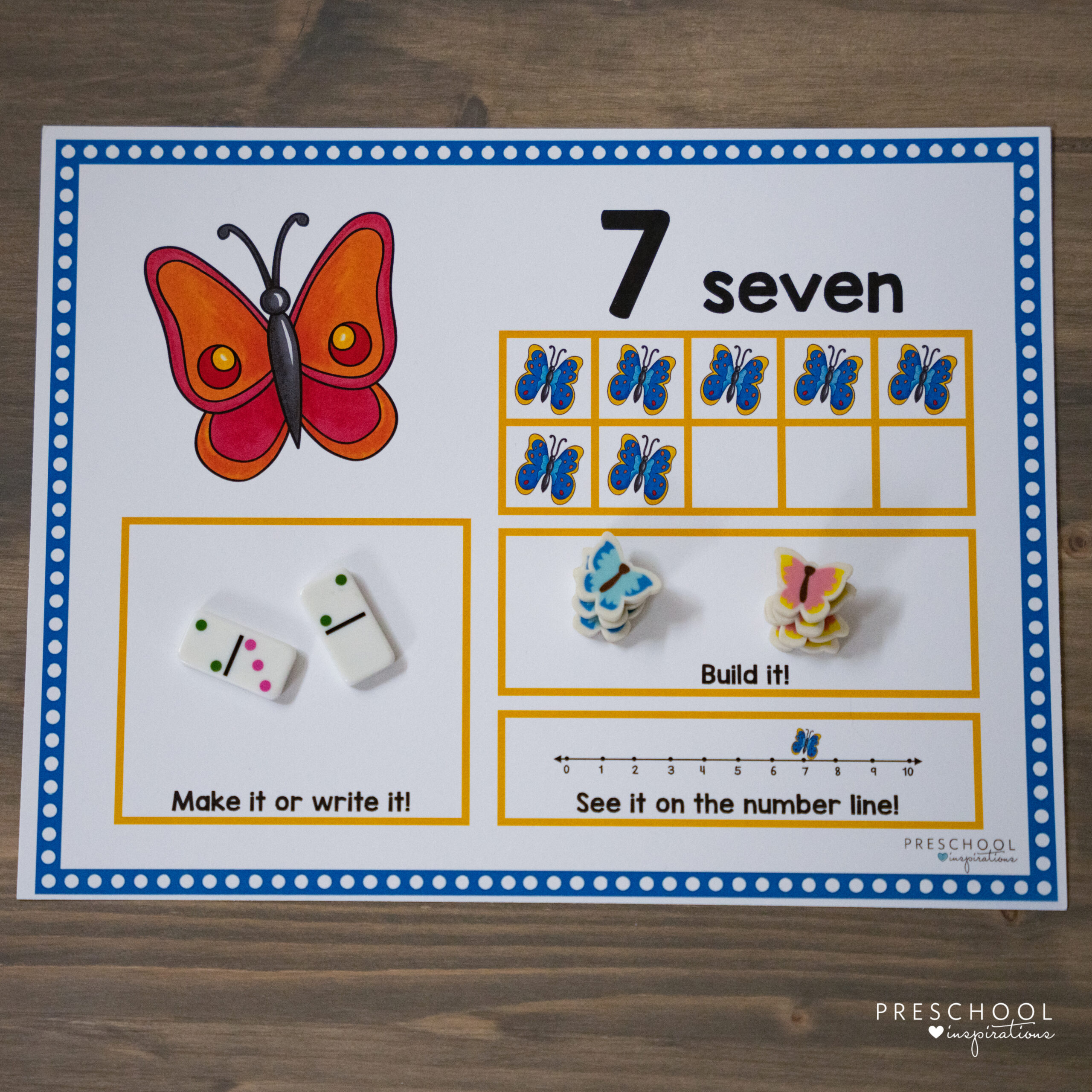 a butterfly ten frame counting mat for preschool that is prefilled with the number seven