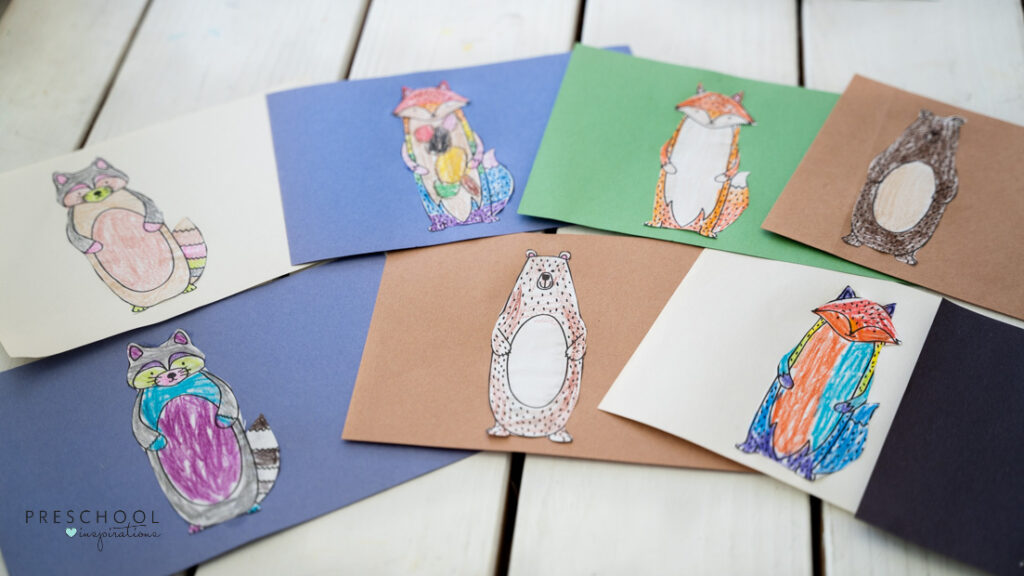 Colored animal templates that are glued onto colored construction paper.
