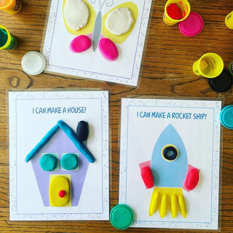 a house playdough mat and a rocketship playdough mat that have been filled in 